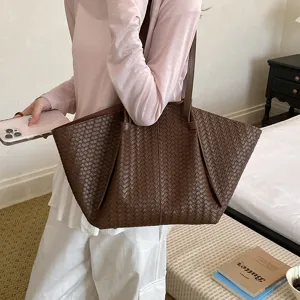 Brown woven leather tote bag for women, stylish large capacity single shoulder handbag detail.