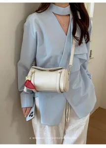 Borsa a tracolla cilindrica minimalista da donna, borsa chic per l'uso quotidiano.