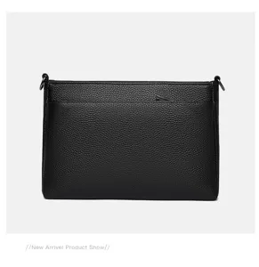 Black genuine leather shoulder crossbody bag detail view with fine texture and metal hardware