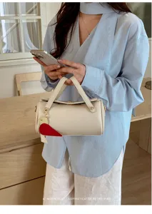 Borsa a mano cilindrica minimalista in pelle con grazioso ciondolo carota, borsa retrò.
