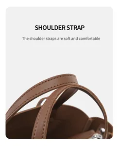 Gros plan détaillé de la sangle de sac à bandoulière en cuir marron au design souple et confortable.