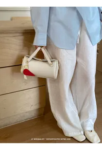 Borsa a tracolla cilindrica minimalista da donna elegante borsa con ciondolo a cuore chic