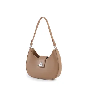 Brown crescent shoulder bag detail, minimalist hobo style PU leather handbag accessory.