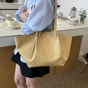 Woven leather shoulder tote bag, large capacity daily casual handbag in stylish light yellow.