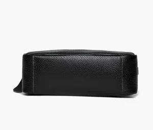 Genuine leather crossbody phone bag detail view, black pebble texture women shoulder bag.
