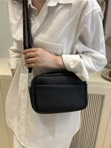 Stylish minimalist black PU leather crossbody bag with wide strap for women daily wear.