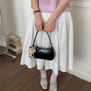 Minimalist black leather shoulder bag women stylish underarm handbag with cute bear charm main view