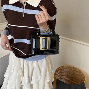 Trendy patent leather shoulder bag with chic gold buckle, retro stylish commuting handbag.