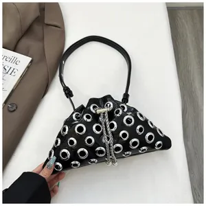 Black leather bucket bag with metal grommets and chain strap for women chic daily fashion.