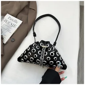 Black metal grommet drawstring handbag, stylish metallic eyelet shoulder pouch for women.