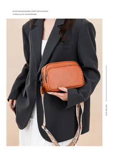 Minimalist litchi pattern women crossbody bag, stylish camera bag with wide strap for daily use.