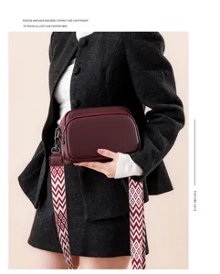 Detailed view of the stylish pebble grain crossbody bag with comfortable wide strap.