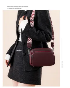 Detailed view of the women's leather crossbody bag, featuring a stylish patterned strap.