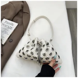 Metallic grommet bucket bag, stylish white PU leather shoulder crossbody bag with chain detail.