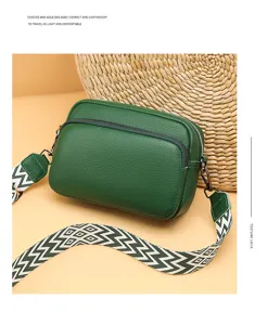 Women's green litchi pattern PU leather crossbody bag with wide patterned strap for daily casual use.