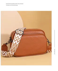 Classic brown litchi pattern PU leather crossbody shoulder bag with stylish geometric strap.