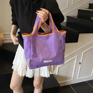 Casual purple canvas tote bag with orange trim, simple daily shopping shoulder bag for women.