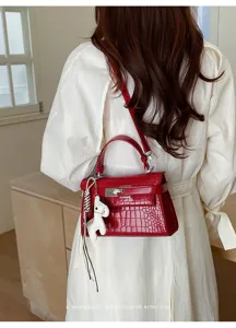 Red crocodile texture shoulder handbag detail view, elegant retro style top handle bag.