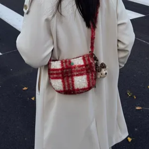 Detailed view of winter retro plaid lamb wool crossbody bag, showing texture and cute bear pendant.