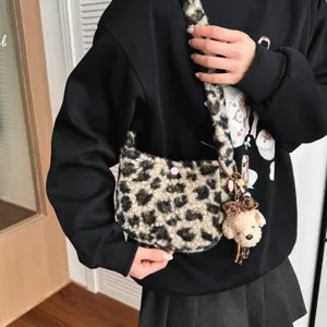Leopard plush shoulder bag with cute puppy charm winter fluffy crossbody bag for women.