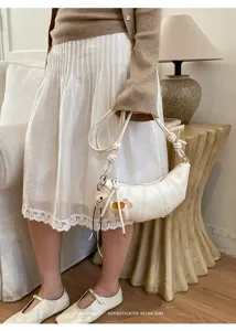 Minimalist white croissant shoulder bag for women, chic pleated dumpling crossbody bag.