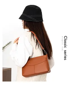 Genuine leather shoulder bag detail view, elegant brown underarm bag for women daily wear.