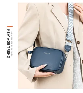 Stylish genuine leather crossbody bag for women with wide strap, versatile casual shoulder bag.