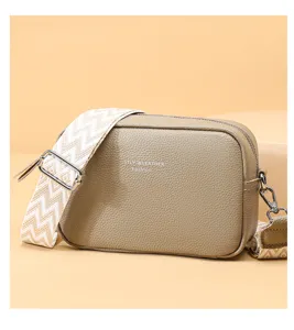 Classic leather crossbody bag with wide strap, versatile casual shoulder bag for women.