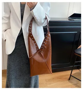Retro oil wax leather shoulder bag for women, vintage rivet hobo tote handbag with large capacity.
