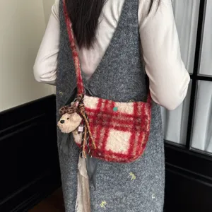 Detailed view of winter plush plaid crossbody bag with cute dog charm and retro wool design.