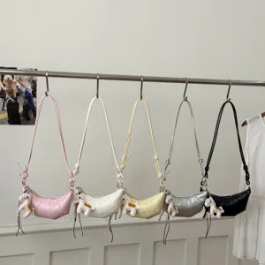 Stylish crescent croissant shoulder bag with cute horse charm, casual multi-color crossbody bag.