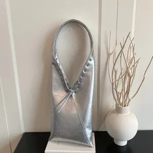 Silver metallic crinkled leather shoulder bag with eyelets, vintage hobo purse for women.