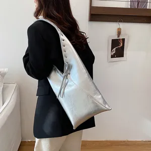 Silver metallic crinkled leather shoulder bag with rivets and side tie, large capacity tote bag.