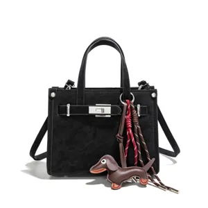 Stylish black women tote handbag with cute puppy charm, commuter shoulder crossbody bag.