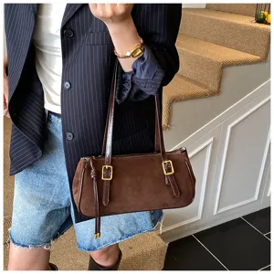 Brown suede shoulder bag for women, stylish underarm pillow bag for daily commute and casual use.