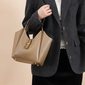 Genuine leather bucket bag for women, large capacity stylish tote bag for daily commute.