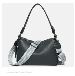 Stylish genuine leather shoulder crossbody bag for women with woven strap and pillow shape.