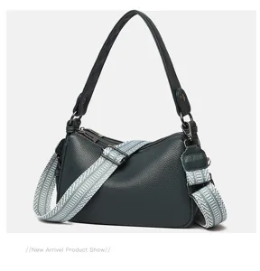 Dark green genuine leather shoulder bag with wide woven strap, stylish saddle pillow design.