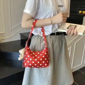 Chic red polka dot shoulder bag, casual underarm cloth handbag with cute bear charm for daily wear.