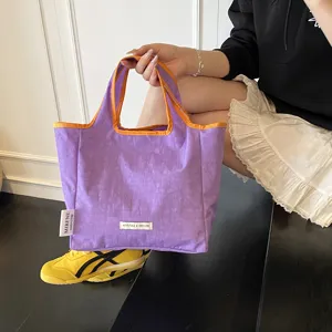 Stylish dopamine colorblock canvas tote bag for women, casual portable shopping bag with contrast handle.