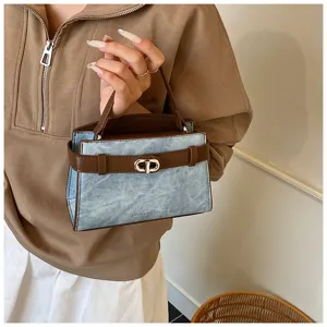 Stylish contrast denim handbag with metal lock and top handle for women daily commute use.