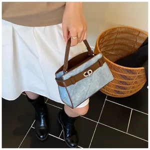 Chic contrast color top handle bag for women, stylish commute crossbody bag with twist lock.