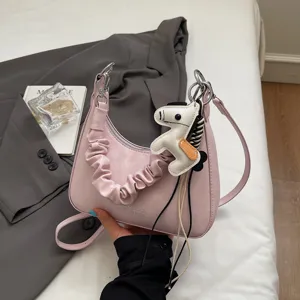 Pink PU leather shoulder bag with ruched strap and cute horse charm for daily casual commuting.