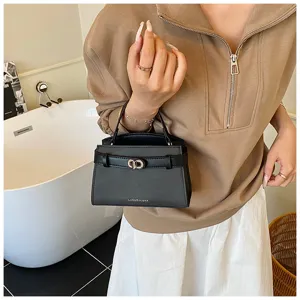 Black women's mini handbag with top handle, sleek turn-lock closure and elegant strap detail.