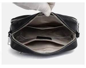 Black multi-layer crossbody shoulder bag for women, large capacity design with zipper.