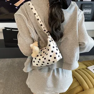 Chic polka dot underarm shoulder bag for women, stylish large capacity daily handbag.