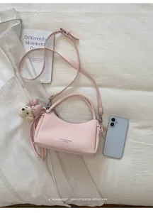 Pink minimalist shoulder crossbody bag, chic daily handbag with cute bear pendant and strap.