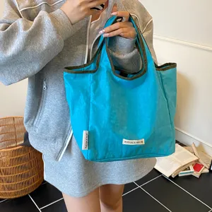 Blue canvas tote bag for women, casual handbag, stylish foldable portable shopping bag.