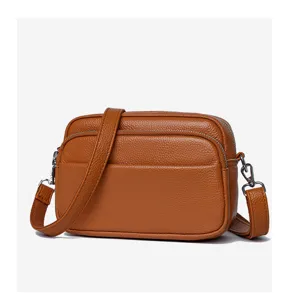 Detail view of the retro genuine leather women crossbody bag showing soft texture and hardware.
