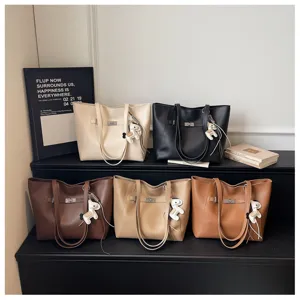 Stylish large capacity tote bag for women, casual commute shoulder bag with charm.